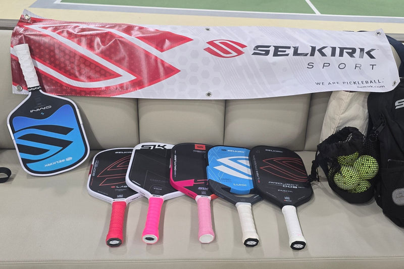Coach showing a range of pickleball paddles during a Paddle Discovery session in Singapore